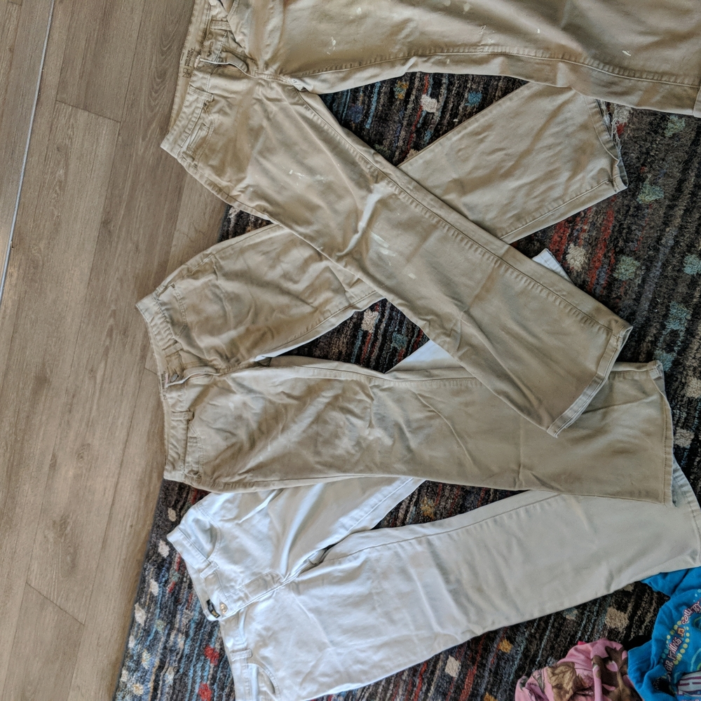 3 pairs of cargo men's pants.   All the same size. Two dark tan 1 light tan.